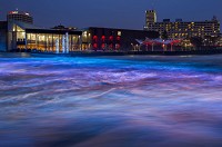 South Bend 'River Lights' illuminate the churning flood waters on the St. Joseph River in this photo using a slow camera shutter speed at Seitz Park Tuesday, Feb. 20, 2018 in South Bend. Tribune Photo/ROBERT FRANKLIN