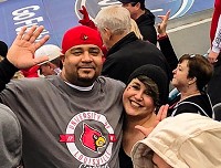 Sean Martin, left, and his girlfriend of four years, Kelley Kinnaird, get close for a photo during a University of Louisville football game on Dec. 30, 2017. Submitted photo