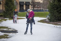 Andrea Peer skates while holding her 3-year-old daughter, Ailie at Nibco Park in downtown Elkhart in this January 2017 file photo. Nibco was opened in 2007 and now Mishawaka and South Bend officials are planning similar facilities in or near their downtowns. Tribune File Photo/MICHAEL CATERINA