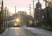 An early morning South Shore train approached the Michigan City station. The proposed double-tracking would move the tracks from the center of the road. Staff photo by John J. Watkins