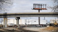 A portion of the Cline Avenue bridge, under construction, stretches across tracks in East Chicago. Staff photo by Kyle Telechan