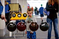 Landon McDowell, 6, looks at a momentum exhibit during an open house Saturday at the ETHOS Science Center in Elkhart. Staff photo by Michael Caterina