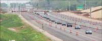 Cars line up Thursday near the Tapp Road and I-69 interchange, seen looking south from Bloomfield Road. Officials say the interchange will open on or around Memorial Day. Staff photo by Jeremy Hogan