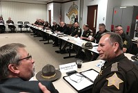 State Rep. Jim Pressel, R-Rolling Prairie, left, talks to Fulton County Sheriff Christopher Sailors during a sheriffs roundtable Tuesday at the Porter County Sheriff's Department. Staff photo by Bob Kasarda
