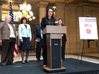 Juliana Williams, program director for Our Backyard, a human trafficking awareness group, speaks Wednesday at the Statehouse. Staff photo by Dan Carden
