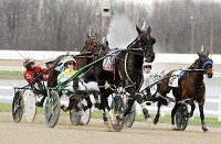 Trace Tetrick&nbsp;drives Legal Eye (10) during the opening night of harness racing at Hoosier Park for 2016 this file photo. Staff photo by Don Knight