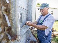 Larry Ender works on his farm on Friday, July 6, 2018, in Bremen. Staff photo by Robert Franklin