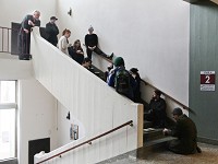 A sculpture class at Antioch College gathers on a flight of stairs to discuss a student's project that she created on the steps on March 10, 2017. For their class assignment that day, students had three hours to create something in the building based on the word "congruent." Staff photo by Meghan Holden