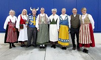 From left, Annette Johansson, Ingeborg Lundberg, Earl Hurst, Kristina Grasso, Aasa Linner, Anne Luke Mark Swanson and Susan Swanson added a touch of Swedish culture to the grand opening celebration for the new Ikea store in Fishers. Staff photo by Andy Knight