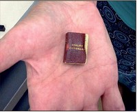Palm device:&nbsp;Among the novelty publications in the Cordell Collection is the world&rsquo;s smallest English dictionary, published in 1890. Staff photo by Mark Bennett