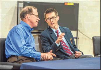Sen. Mike Braun, R-Ind., left, talks with Headmaster Stephen Shipp Friday during a visit to Seven Oaks Classical School. (Jeff Norris / Courtesy photo)