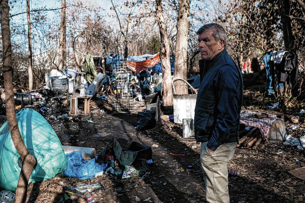 Columbus Code Enforcement officer Fred Barnett inspects the homeless camp off the People Trail behind the old REMC building off Second Street in Columbus, Ind., Thursday, Dec. 14, 2023. The camp is located on property owned by Mariah Foods. Barnett is tasked with clearing homeless camps in the city limits with the help of the Columbus Police Department. Gutierrez and the others in camp were issued trespass warnings and given until Monday to be off the property. Staff photo ny Mike Wolanin