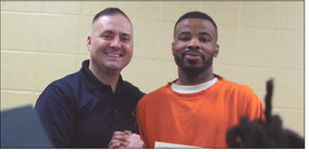 Timothy Tyler (right), an inmate at the Clark County Jail, poses for a photo with Clark County Sheriff Scottie Maples after receiving a certificate for completing a pre-apprenticeship construction program. This will allow him to enter a carpentry apprenticeship after he is released from jail. Brooke McAfee | News and Tribune