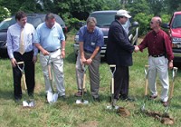 On hand for Tuesday's groundbreaking of the Putnam Ethanol plant near Cloverdale were (from left) Greencastle/Putnam County Development Center Director Bill Dory, Putnam Ethanol President Mike Kessler and Midland-Impact CEO Kevin Still while Putnam Ethanol CEO Terrence O'Malley shakes hands with Gov. Mitch Daniels after the first earth had been turned at the ceremony.
