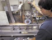 CUT TO SIZE John Stanbaugh grinds a spline into a broach at Kokomo’s Hoosier Spline Broach Corp., which has supplied broaches to Delphi plants in Moraine, Ohio, and Saltillo, Mexico. (KT file photo)