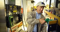 Gov. Mitch Daniels fills up RV-1 at the first B20 soy biodiesel public pump at Energy Plus 24 gas station, 1105 Production Road. Dean Musser Jr./The Journal Gazette