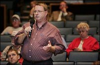 Carroll County Commissioner Loren Hylton speaks Sunday during the U.S. Department of Transportation public hearing about the time zone issues at Logansport High School. By Tom Leininger/Journal and Courier
