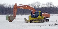 What will rise?
Some earth-moving equipment stands ready at the site where a George Weston Bakeries plant may someday be built in Remington South Industrial Park. Photo: Fred Flury / The Truth
