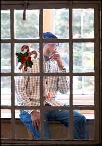 Dave Jones, who uses the Hope House at the Richmond State Hospital, takes a smoke break on porch designated for those who smoke. Palladium-Item photo by Steve Koger