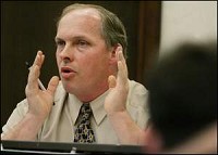 West Lafayette city councilman Gerry Keen, R-District 5, proposes an amendment Monday to the proposed smoking ordinance allowing bars and restaurants to have smoking after 9 p.m. By Tom Leininger/Journal and Courier