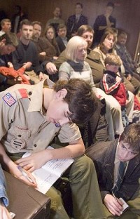Jake Kollar (left) and Chris Aemmer, Boy Scouts with Troop 300 of the LaSalle Council in South Bend, take notes at a meeting of the St. Joseph County Council Tuesday. The Scouts are working on their communications merit badges, and the non-smoking ordinance in front of the council had their full attention. Photo: Mark Shephard / The Truth