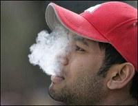Nizam Saleem takes a smoke break near Stewart Center at Purdue University. Saleem is a sophomore at the school. By Frank Oliver/Journal and Courier
