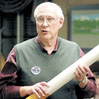Dick Huber of Greenwood holds a large cardboard cigarette as a prop when he addresses the Franklin City Council on Monday night. The council voted to table discussion of a citywide smoking ban until April 10 and will not vote on the issue until April 24 at the earliest.&nbsp;PHOTO BY SCOTT ROBERSON