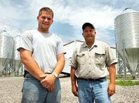 Ryan McClure, left, with father Terry McClure invested almost a half-million dollars in their hog operation in Grover Hill, Ohio. Photo by Janelle Sou Roberts/The Journal Gazette