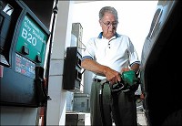 FILL ’ER UP: Tom Wellinger fills up his truck with soy bio-diesel fuel at the Energy PLUS 24 in Tipton. (KT photo by Erik Markov)