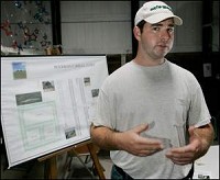 Carroll County farmer Terris Ayres talks about possibly providing all of the cattle and some of the crops for the Boerman-Carroll Dairy Farm. By John Terhune/Journal &amp; Courier