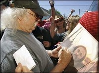 David Crosby of Crosby, Stills, Nash and Young signs autographs Saturday in Reynolds. Crosby stopped on his way to Noblesville to support the making of biofuels. By Michael Heinz/Journal &amp; Courier