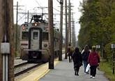 Commuters walk to their cars after exiting a South Shore train from Chicago at Dune Park in Chesterton. According to NICTD, South Shore ridership is the fastest-growing in the country. Lisa Schreiber/Post-Tribune