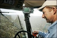 Steve Kerkhove harvests his last field of corn Thursday near West Lafayette. Corn prices have gone up since the ever-expanding biofuels have come on the scene. By Michael Heinz/Journal &amp; Courier