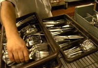 Carlos Deleon sorts silverware at Casa Grille. Data show only 2 percent of Indiana hourly workers earn at or below the minimum wage. Laura J. Gardner/The Journal Gazette 