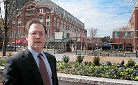 Jason Freier of Hardball Capital, owner of the Fort Wayne Wizards, stands in the courtyard of Atlantic Station, a development in Atlanta that mixes retail stores, homes and restaurants. Freier points to it as an example of what could be done in downtown Fort Wayne. Photo by Ron Shawgo/The Journal Gazette