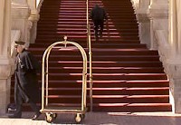 Doorman Dan Clark moves a luggage dolly after loading luggage into a car at the French Lick Resort Casino.