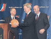 Mayor Graham Richard, left, NBA Vice President and Chief Marketing Officer Shawn Smith, right, and retired CEO of AT&amp;T Wireless Services John Zeglis pass around a basketball. Zeglis, along with several local investors, brought an NBA Development League team to Fort Wayne. (Photo by Derrick Gingery)