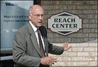 Roger Feldhaus, executive director of Tecumseh Area Partnership, Inc., speaks Thursday during ribbon cutting ceremonies for the REACH (Regional Employment Assessment Center for Hiring) Center. By John Terhune/Journal &amp; Courier)