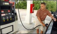 Al Lichkay of South Bend puts fuel in his truck Tuesday. Lichkay says his car was on empty, but he supports the gas purchase boycott. Tribune Photo/GREG SWIERCZ