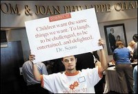 SOMETHING TO THINK ABOUT - Volunteer Jacob Cottrell, a junior at Mississinewa High School, mingles Friday morning with people gathering for the start of Synergy '07 at Indiana Wesleyan University's Phillippe Performing Arts Center. JEFF MOREHEAD / jmorehea@marion.gannett.com