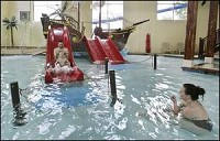 Dillon Lanum, 5, along with his father, Bill, and mother, Sumer, play at the newly opened Buccaneer Bay on Friday at the Best Western in Lafayette. By Frank Oliver/Journal &amp; Courier