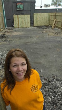 Ann Marie Peters, co-owner of the 412 Club, stands where the bar is building an outdoor beer garden to accommodate smokers. Clint Keller/The Journal Gazette