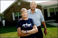 Edith and Richard Mandy stand in front of the home they built on their property for Richard’s mother. Melanie Maxwell / The Star Press
