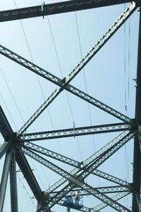 A bridge worker performs maintenance on the northbound bridge of the twin bridges in Henderson, Ky., on Thursday afternoon. DENNY SIMMONS / Courier &amp; Press