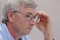 Caption: Mike Yoder, Elkhart County commissioner, listens during a property tax summit Wednesday at the Elkhart County Public Services Building. County officials from neighboring counties met Wednesday to discuss solutions to the property tax controversy. Photographer: J. Tyler Klassen