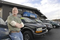 Gary Elliott in front of his used car lot. USA-1 Auto Sales, on Nappanee Street in Elkhart. Truth photo by J. Tyler Klassen