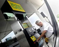 Paul Grant of Kokomo stops Friday to fill up his 2007 Yukon FlexFuel with E85 at the Family Express gas station on Indiana 38 in Lafayette. Grant says uses E85 because he wants to get away from using foreign oil, and it's better for the environment. By Jamie Lynn Chevillet/Journal &amp; Courier