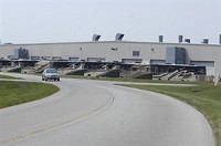 A car travels past plant 2 of the Monaco Coach facilities on Nelsonâ??s Parkway in Wakarusa Thursday, July 17, 2008. A row of class A units are parked in the lot. The company announced lay-offs affecting 1,400 workers at the Wakarusa, Elkhart and Nappanee plants. Truth Photo By Jennifer Shephard