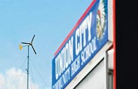 This 90-foot wind turbine with 8-foot-long blades generates 1,000 watts of power for Union City Community High School. School officials have a project planned for a 700-kilowatt-hour tower that would power the entire school. (KYLE EVENS / THE STAR PRESS)