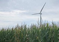 A wind turbine sits along a county road Friday in Benton County near Fowler. By Michael Heinz/Journal &amp; Courier